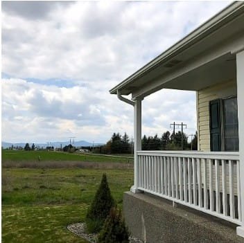 House porch with scenic landscape view