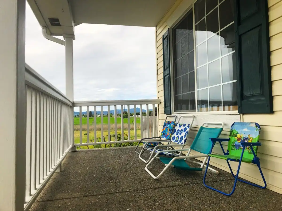 Summer porch decor with simple folding chairs and mountain views showing small front porch potential